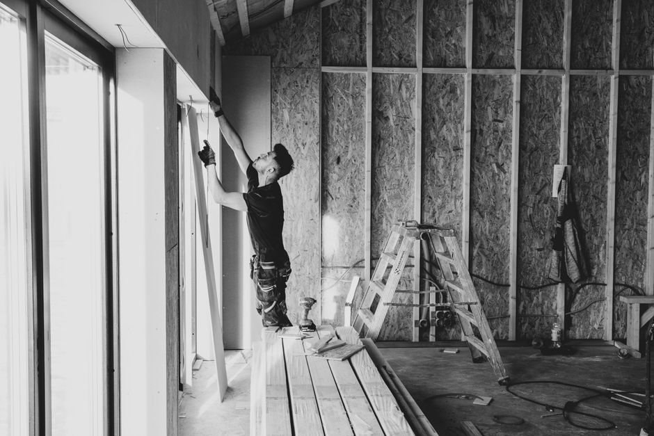 Dedicated window installation contractor reviewing project plans